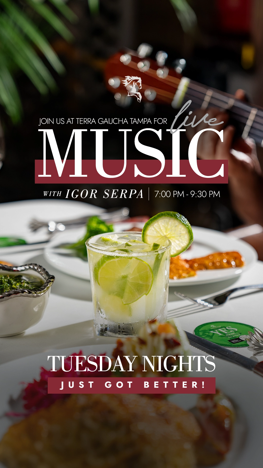 A refreshing Caipirinha sits on a table with a guitar playing in the background, promoting live music with Igor Serpa at Terra Gaucha Tampa. The image highlights a vibrant dinner setting with food, such as grilled meats and sides, alongside the cocktail. The event is scheduled from 7:00 PM to 9:30 PM, making Tuesday nights at Terra Gaucha Tampa even better with Brazilian tunes and delicious food.
