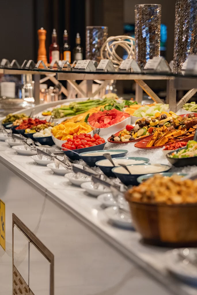 Exterior view of a Terra Gaucha Steakhouse with parked cars in front.
